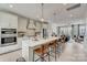 Open concept kitchen with island, stainless steel appliances, and light cabinetry at 707 Hoke Ln, Davidson, NC 28036