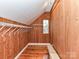 Walk-in closet with wood paneling and shelving at 730 High Rock Crusher Rd, Wadesboro, NC 28170