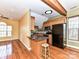 Kitchen with granite counters, stainless steel appliances, and wood cabinets at 730 High Rock Crusher Rd, Wadesboro, NC 28170