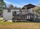 View of a backyard deck with stairs, a covered entertaining space, and access to the house at 7314 Entwhistle Ct, Charlotte, NC 28226