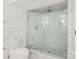 Modern bathroom featuring a glass-enclosed shower with decorative tile accent and a low-flow toilet at 7314 Entwhistle Ct, Charlotte, NC 28226