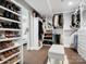 Spacious walk-in closet with custom shelves and hanging racks for optimal organization and plentiful storage at 7314 Entwhistle Ct, Charlotte, NC 28226