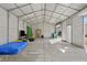 Spacious metal building with concrete floor, fluorescent lighting, and ample space for vehicles and storage at 7314 Entwhistle Ct, Charlotte, NC 28226