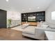 Stylish living room showcasing custom built-ins, a modern sectional sofa, and an open layout with natural light at 7314 Entwhistle Ct, Charlotte, NC 28226