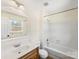 Bright bathroom with updated vanity, tile floors, and shower-tub combination at 7440 Apple Creek Dr, Mint Hill, NC 28227