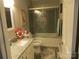 Bathroom with glass-enclosed shower, granite vanity, and tile floor at 8188 Normandy Rd, Denver, NC 28037