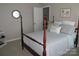 Bedroom featuring a four-poster bed and light gray bedding at 8188 Normandy Rd, Denver, NC 28037