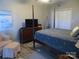 Comfortable bedroom with a four poster bed, tv, and closet at 8188 Normandy Rd, Denver, NC 28037