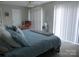 Bright bedroom with neutral walls, ceiling fan, and natural light at 8188 Normandy Rd, Denver, NC 28037