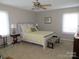 Light-filled bedroom with ceiling fan and a comfortable bed at 8188 Normandy Rd, Denver, NC 28037