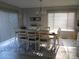 Bright dining room with large windows and a modern chandelier at 8188 Normandy Rd, Denver, NC 28037