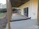 Covered patio perfect for relaxing and entertaining outdoors near the yard at 8188 Normandy Rd, Denver, NC 28037