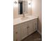 Bathroom vanity with a white countertop, modern fixtures, and white cabinets at 833 E Chestnut St, Stanley, NC 28164