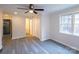Neutral bedroom with ample closet space and a large window offering natural light at 833 E Chestnut St, Stanley, NC 28164