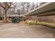 Carport with concrete slab and large yard at 833 E Chestnut St, Stanley, NC 28164