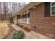 Brick house with white porch and landscaping at 833 E Chestnut St, Stanley, NC 28164