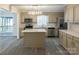 Bright kitchen with stainless steel appliances, center island, and stylish countertops at 833 E Chestnut St, Stanley, NC 28164