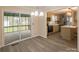 Bright dining area open to the kitchen and screened in porch at 833 E Chestnut St, Stanley, NC 28164