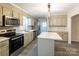 Modern kitchen features sleek countertops, stainless steel appliances, and ample cabinet space at 833 E Chestnut St, Stanley, NC 28164