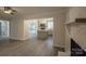 Cozy living room showing the fireplace and the access to the modern kitchen at 833 E Chestnut St, Stanley, NC 28164