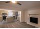 Spacious living room showcasing fireplace and seamless flow to modern kitchen with island at 833 E Chestnut St, Stanley, NC 28164