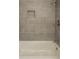 Tile shower and white tub at 833 E Chestnut St, Stanley, NC 28164