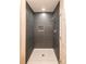 Modern shower with gray tiling, a built-in niche, and sleek fixtures at 833 E Chestnut St, Stanley, NC 28164