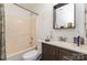 Bathroom with a shower-tub combo and a single sink vanity, maximizing space with an efficient layout at 9415 Melanie Thompson Dr, Charlotte, NC 28213