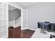 Home office with hardwood floors and built-in shelving at 1009 Hickory Pine Rd, Waxhaw, NC 28173