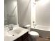 Well-lit bathroom features a vanity sink, combination tub and shower, and a large mirror at 11724 Blessington Rd, Huntersville, NC 28978