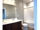 Bathroom features a double vanity, a large mirror, and a shower tub combination at 11724 Blessington Rd, Huntersville, NC 28978
