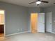 This room features three doors including a walk-in closet, and a ceiling fan at 11724 Blessington Rd, Huntersville, NC 28978