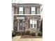 Charming townhome with a stone facade and decorative shutters, well-manicured landscaping at 11724 Blessington Rd, Huntersville, NC 28978