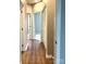 Hallway with hardwood flooring and a view of the doorways to the bedrooms at 11724 Blessington Rd, Huntersville, NC 28978
