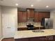 Modern kitchen with stainless steel appliances, granite countertops, and ample cabinet space at 11724 Blessington Rd, Huntersville, NC 28978