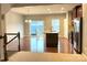 Open floor plan with kitchen island, stainless appliances, and a door to the deck at 11724 Blessington Rd, Huntersville, NC 28978
