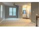 Bright living room featuring neutral carpet, a ceiling fan, and a view of the entry way at 11724 Blessington Rd, Huntersville, NC 28978