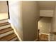 Staircase with wood and white steps that lead to the basement at 11724 Blessington Rd, Huntersville, NC 28978