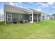 Large backyard with a screened-in porch extending the living space outdoors at 119 Winterberry St, Mooresville, NC 28117