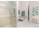 Bright bathroom with tiled shower and soaking tub with decor at 119 Winterberry St, Mooresville, NC 28117