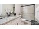 Bathroom featuring a modern vanity with black fixtures and a glass shower at 119 Winterberry St, Mooresville, NC 28117