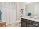 Bathroom featuring a vanity with a granite countertop and a shower with white curtains at 119 Winterberry St, Mooresville, NC 28117
