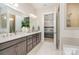 Bright bathroom featuring a double sink vanity and a soaking tub with a separate tiled shower at 119 Winterberry St, Mooresville, NC 28117