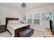 Bedroom features a queen bed, leather bench, and neutral decor at 119 Winterberry St, Mooresville, NC 28117