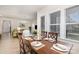 Dining room with wood table and chairs, large window at 119 Winterberry St, Mooresville, NC 28117