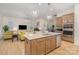 Open-concept kitchen with a large island, flowing into a cozy living room, perfect for entertaining at 119 Winterberry St, Mooresville, NC 28117