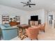 Bright living room features high ceilings, a ceiling fan, and contemporary furnishings at 119 Winterberry St, Mooresville, NC 28117