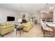 Open-concept living space with a modern kitchen, comfortable seating, and abundant natural light at 119 Winterberry St, Mooresville, NC 28117