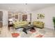 Open-concept living room with view to kitchen, stylish furniture, and decor at 119 Winterberry St, Mooresville, NC 28117