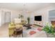 Bright living room with neutral walls and a large decorative area rug at 119 Winterberry St, Mooresville, NC 28117